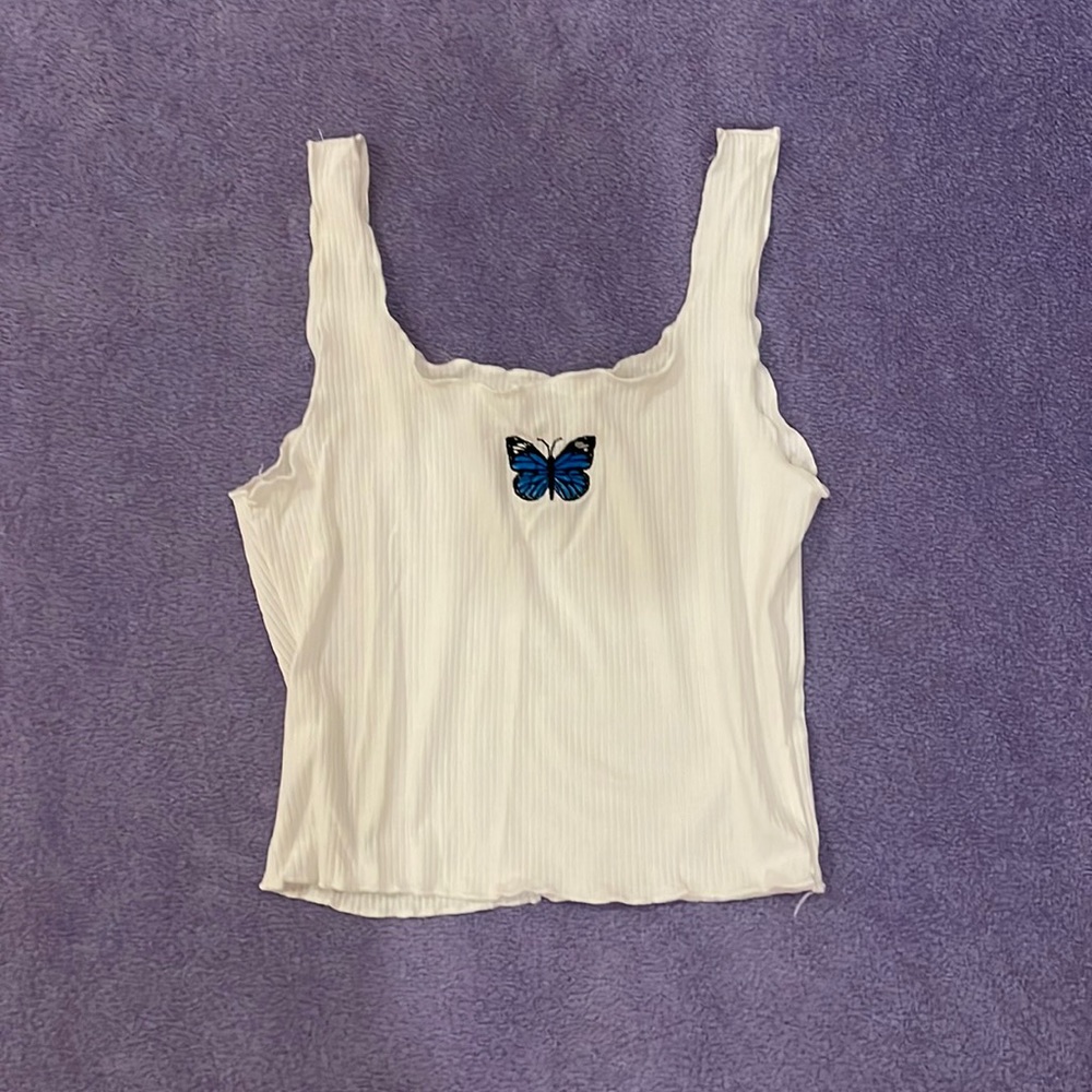 Simple white tank with butterfly design